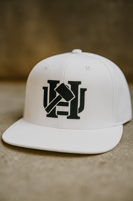 White cap with an embroidered logo.  